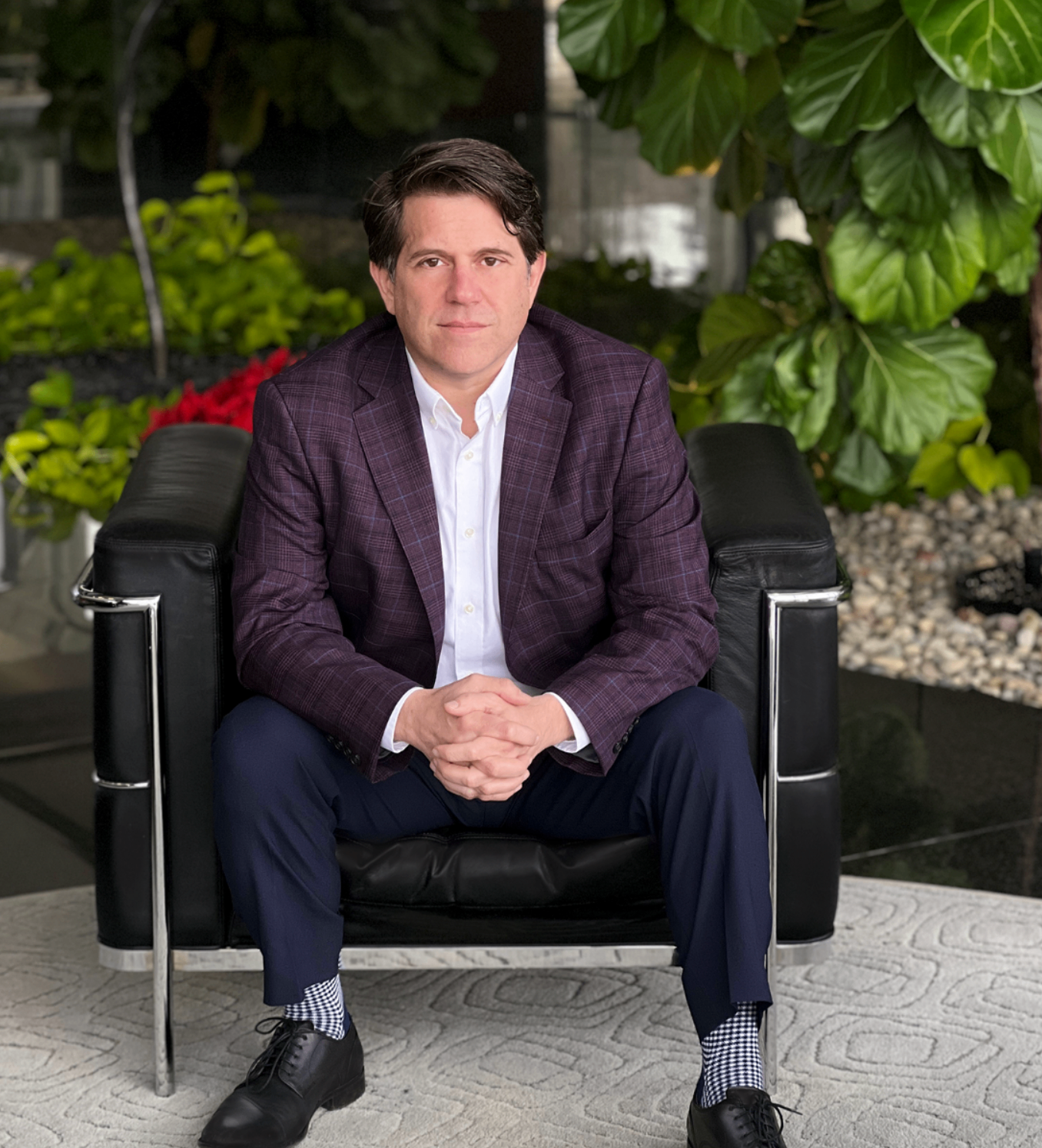 Tom Economy, Michigan mediator, seated portrait